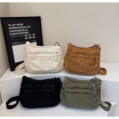👜✨ Distressed Canvas Messenger Bag – Multi-Zipper Layered Design, Wide Adjustable Strap